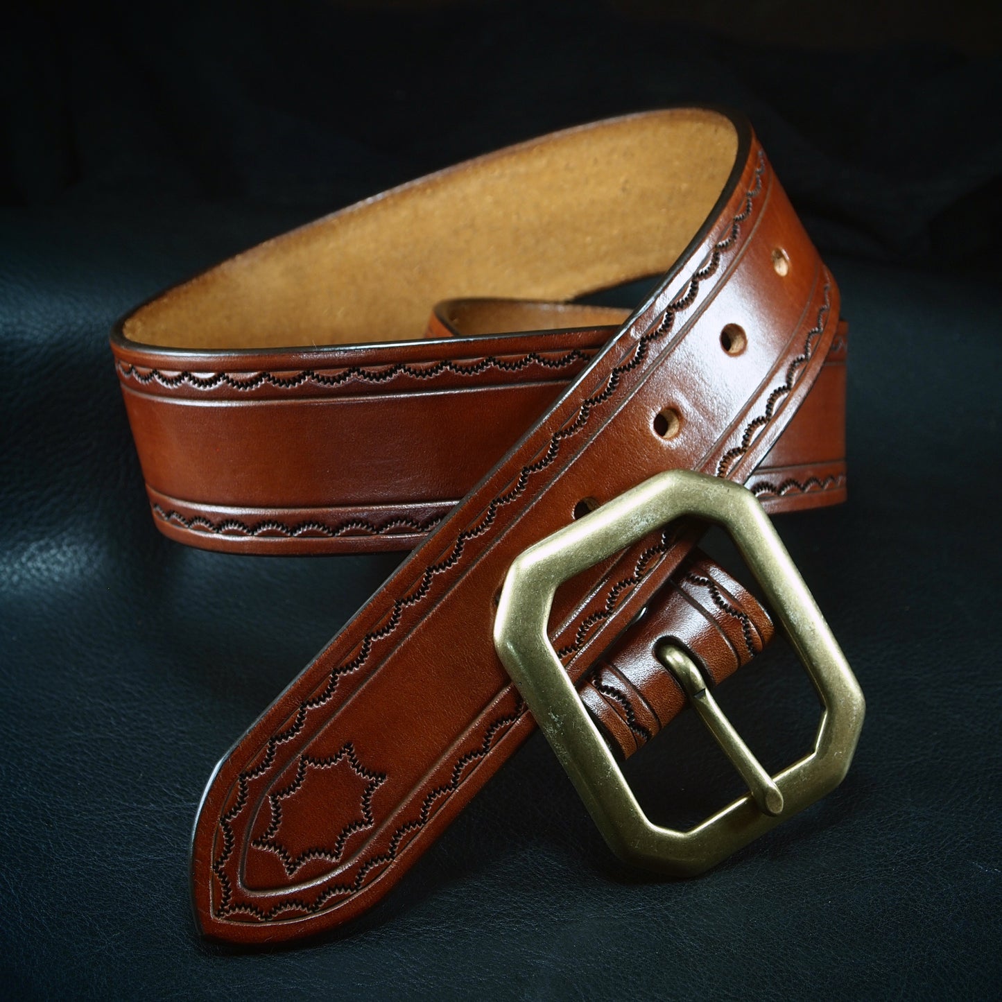 Hand tooled brown belt. Unique FM design