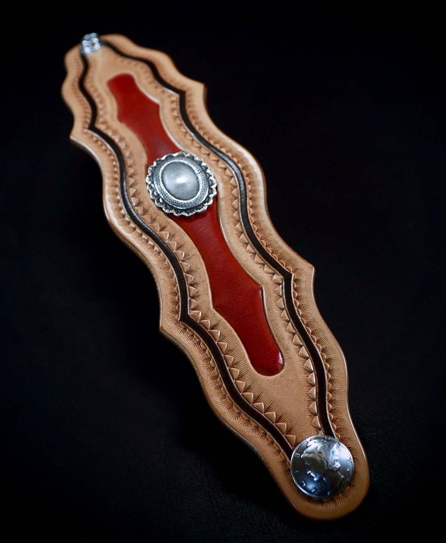 Native design carved and stamped leather cuff