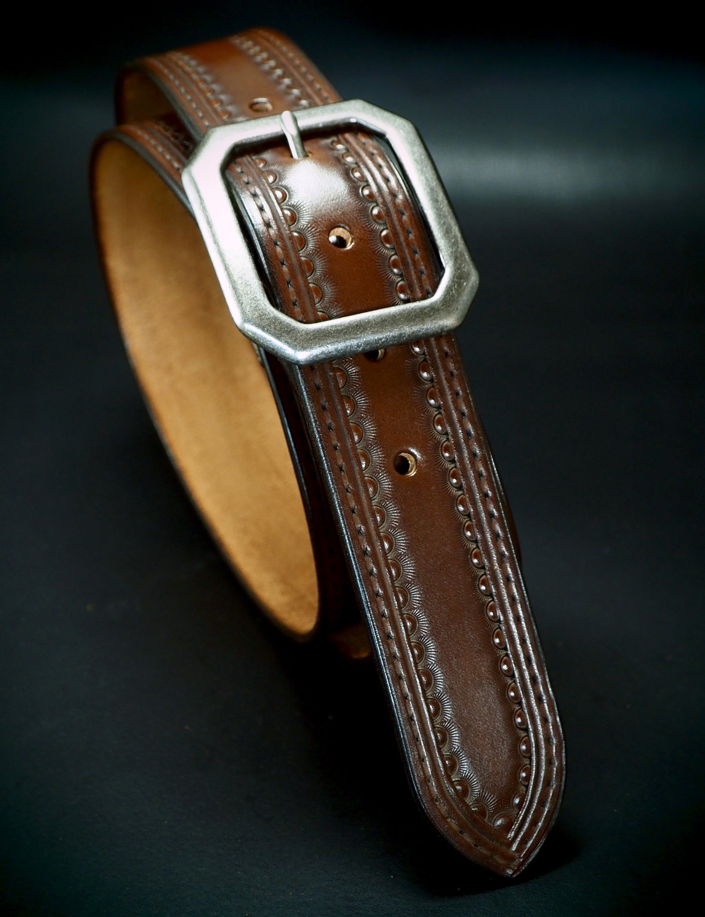 Hand tooled 1.5" rich walnut stamped belt. Unique FM design