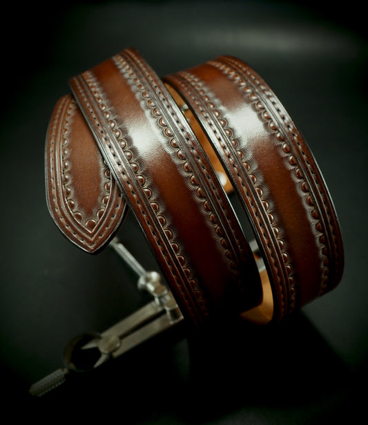 Hand tooled 1.5" rich walnut stamped belt. Unique FM design