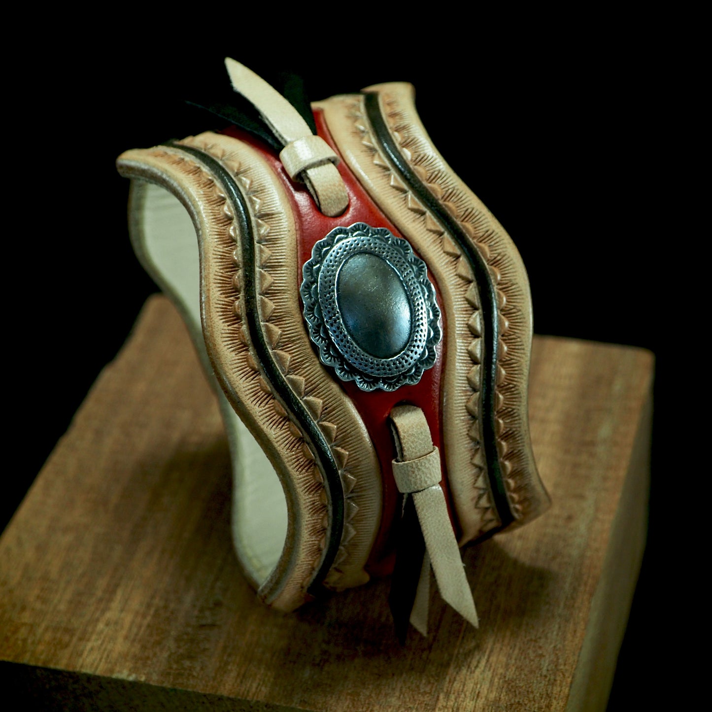 Native design carved laced and stamped leather cuff