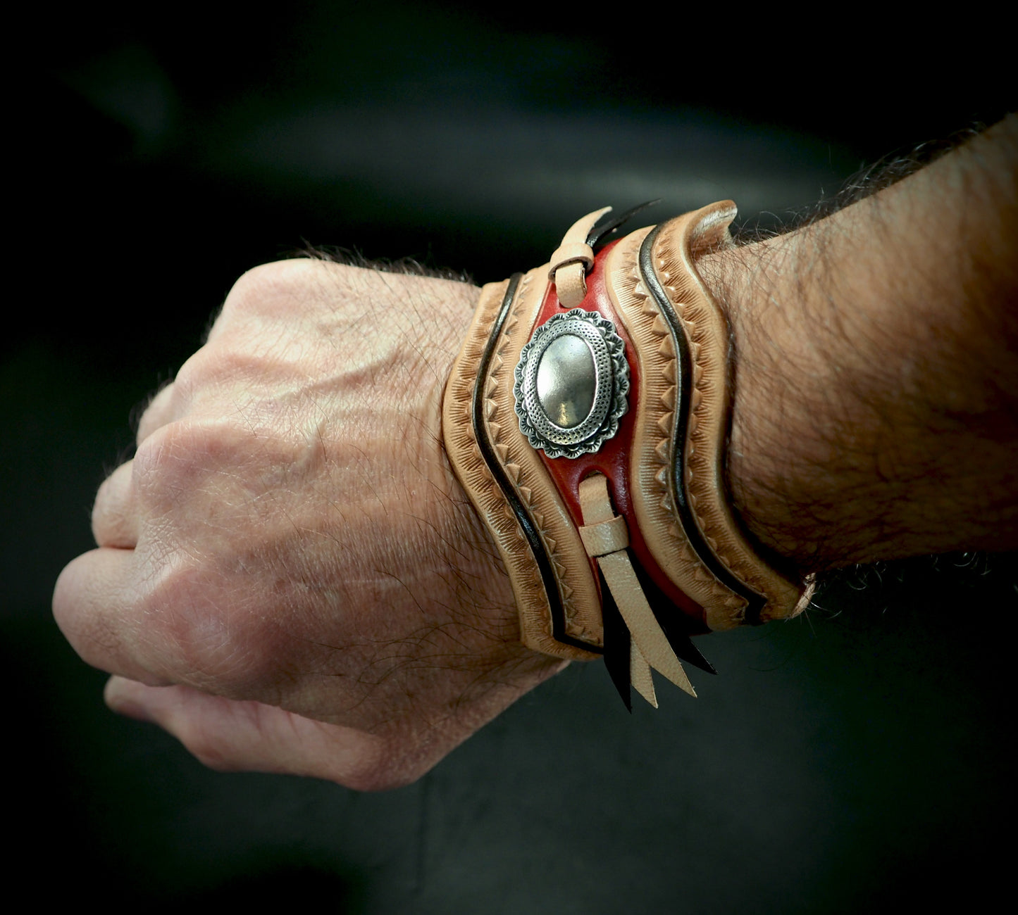 Native design carved laced and stamped leather cuff