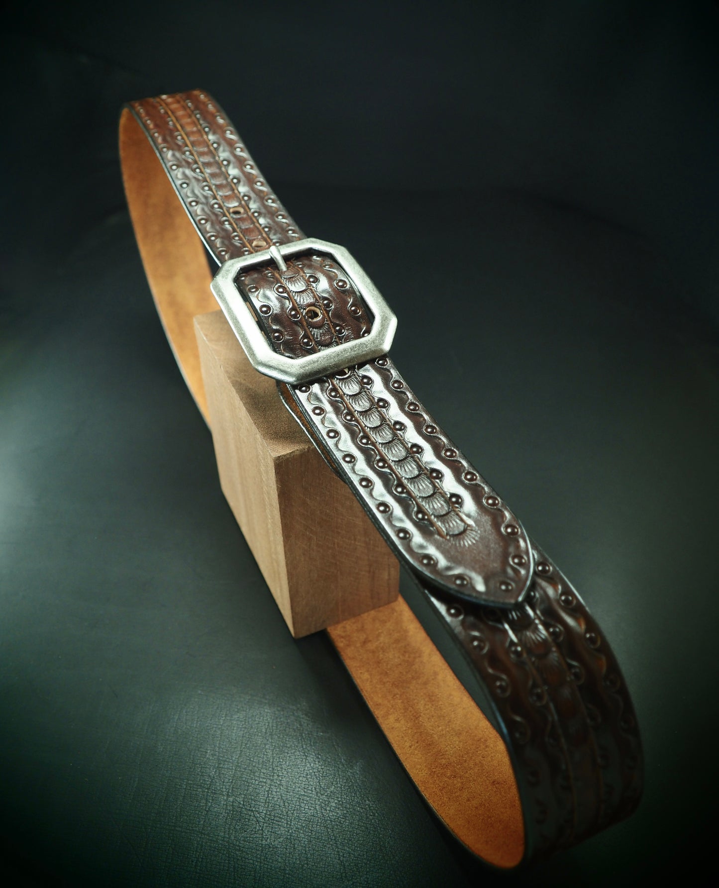 Hand tooled 1.5" rich walnut Fluid stamped belt. Unique FM design