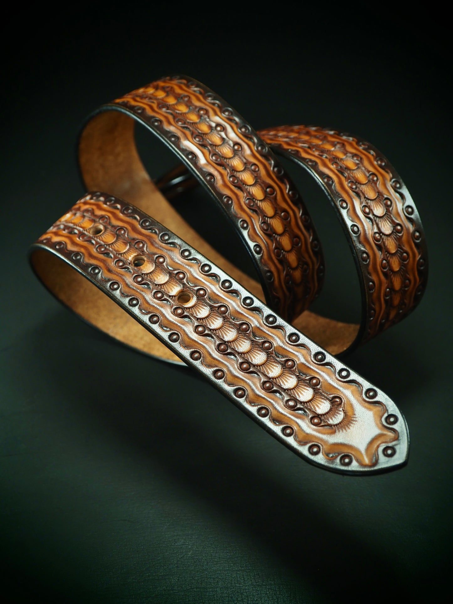 Hand tooled 1.5" rich Sunburst Fluid stamped belt. Unique FM design