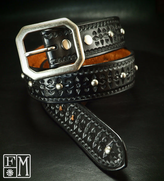 Hand studded black tooled belt. Unique FM design